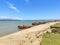 Seaside Serenity: A Captivating Coastal Landscape with Boat, Sky, and Sea