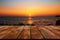 Seaside serenity An empty table with a stunning, blurred sea sunset