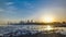 Seaside skyline of Kuwait city sunrise timelapse