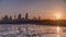 Seaside skyline of Kuwait city sunrise timelapse