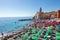 Seaside town of Camogli with tourist coastline. Ancient and historic Italian town facing the sea with colorful buildings.