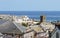 Seaside Village of St. Ives, Cornwall, UK. View over old town with typical houses and Saint ives church in afternoon summer.