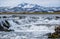 Season changing in southern Highlands of Iceland. Picturesque waterfal Tungnaarfellsfoss panoramic autumn view.  Landmannalaugar