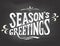 Season\'s greetings on chalkboard background