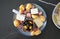 Seasonal appetizer platter with olives, cheese, meat and oranges