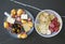 Seasonal appetizer platter with olives, cheese, meat and oranges