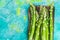 Seasonal asparagus on wooden board