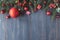 Seasonal background with decorated Christmas tree twigs on dark