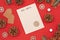 Seasonal Christmas holiday flat lay with concept for children letter to Santa Clause with white empty letter, pine cones