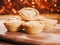 Seasonal delicious mince pie pastry on a wooden table, Glitter warm color background. Popular Christmas season dessert