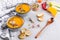 Seasonal fall autumn roasted orange pumpkin carrot soup with ingredients