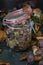 Seasonal mushroom picking. Preparations for the winter, making homemade marinades. Marinated mushrooms in a glass jar standing on