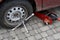 Seasonal tire fitting. Replacement of summer tires for winter tires. Balance wrench and hydraulic jack. Car service station