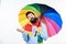 Seasonal weather forecast. Man bearded hipster hold colorful umbrella. It seems to be raining. Rainy days can be tough