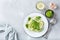 Seasonal zucchini spaghetti pasta noodles with spinach pesto sauce