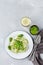 Seasonal zucchini spaghetti pasta noodles with spinach pesto sauce