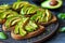 Seasoned Avocado Toast on Rustic Dark Surface