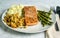 seasoned salmon with stuffing and asparagus