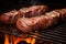 seasoned skewered beef steaks slowly rotating over a hot charcoal grill