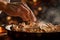 Seasoning the Sizzle: Chefs Hand Sprinkling Salt on Mushroom and Onion Skillet