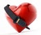 Seatbelt around the red heart. 3D illustration