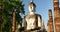 Seated Buddha  at Wat Si Chum temple in Sukhothai Historical Park, Thailand.