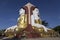 Seated Buddhas at Kyaikpun Pagoda in Bago, Myanmar