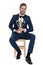 Seated businessman holds trophy cup with both hands