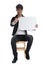 Seated casual man holding speech bubble and pointing forward happy