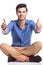 Seated casual man making the ok thumbs up gesture