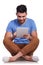 Seated happy casual man working on his tablet