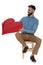 Seated romantic man in blue jeans shirt offers red heart