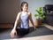 Seated spinal twist pose yoga asian woman home workout fitness body weight exercise pilates health training sport healthy