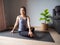 Seated spinal twist pose yoga asian woman home workout fitness body weight exercise pilates health training sport healthy