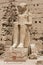 Seated statue in front of the seventh Pylon of the Amun Temple, Karnak, Luxor, Egypt