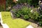 A seating area in a homey, ecological garden.