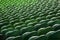 Seating rows in a stadium with weathered chairs