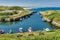 Seaton Sluice Harbour, a small inlet in Northumberland, Northern England with small boats.