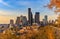 Seattle downtown at sunset in the fall with yellow foliage in the foreground view from Dr. Jose Rizal Park