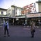 Seattle, WA / USA - April 6 2020: An encounter maintaining a safe distance, social distancing, in public spaces, Pike Place Market