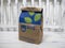 Seattle, WA USA - circa March 2022: Angled view of a brown paper Rite Aid bag sitting on a wooden bench, with a prescription