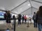 Seattle, WA USA - circa May 2021: View of people waiting in line for security checks before receiving the covid 19 vaccine at