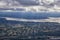 Seattle, Washington, 2019 Cityscape Aerial Panoramic View through cloudscape including Ocean, rivers and rural urban.