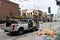 Seattle, Washington, USA - April 2, 2021: ford city service car with man in uniform at sewerage