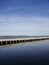 Seaview with stone, concrete pier in Noblessner on sunny morning. Yellow stair. Tallinn, Estonia, Europe. April 2022