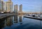 Seawall and boats in city marina.