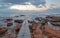 Seawall at Dawn over St James Beach at morning sunrise in Cape Town South Africa