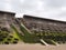 Seawall south of blackpool constructed of concrete honeycomb type structures with steps leading to the beach covered in tidal