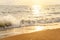 Seawater soft wave crashing on sandy beach seaside in summer on sunset time. summer vacation activity background concept