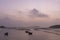 At the seaweed farm before sunrise in the morning, there are seaweed rows and boats